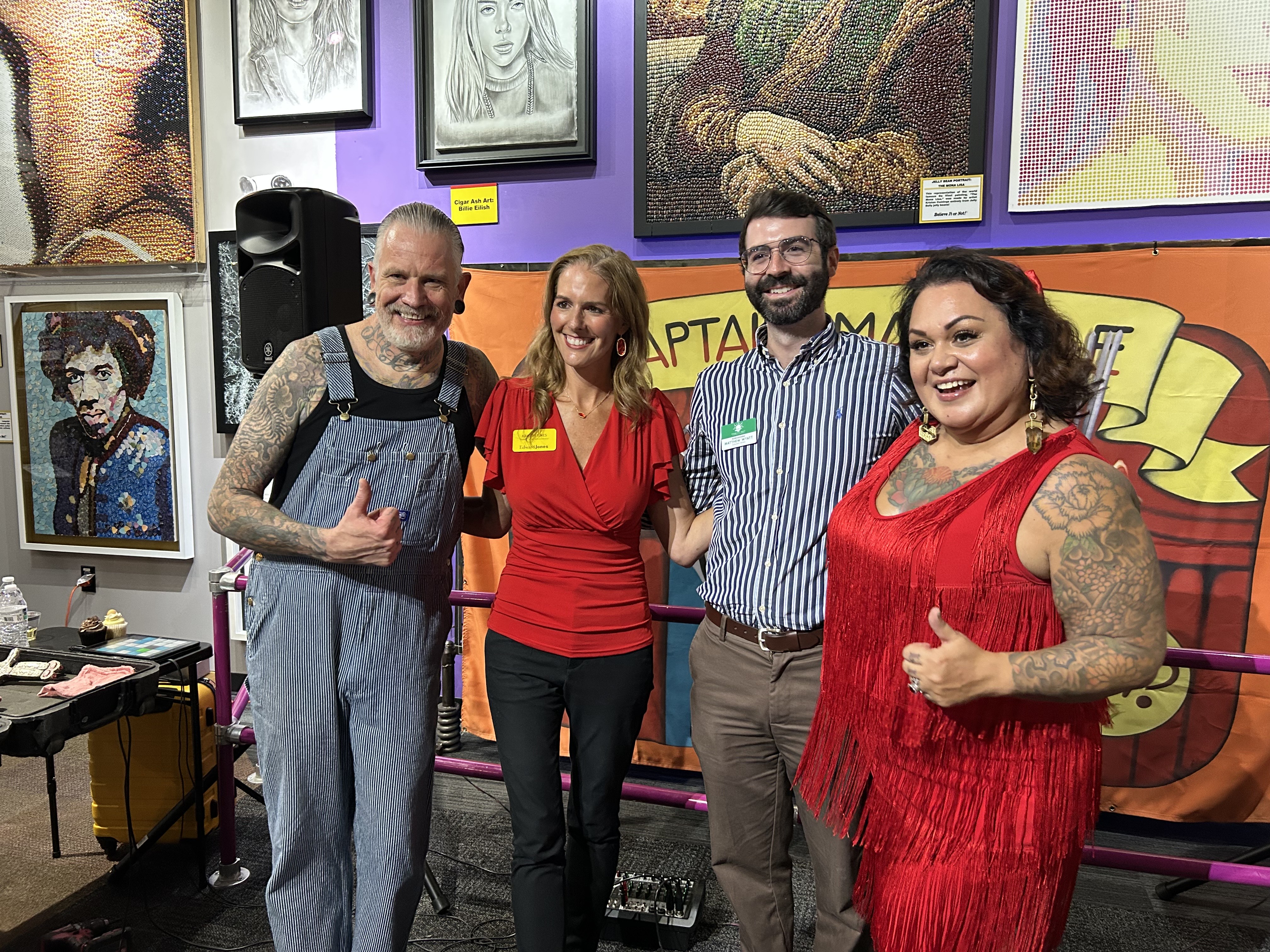 A-Team Members posing for a photo at an art exhibit.